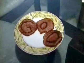 Woman sees GoD in Salami. Why would a god choose salami? So many other options exist. This is just dumb.